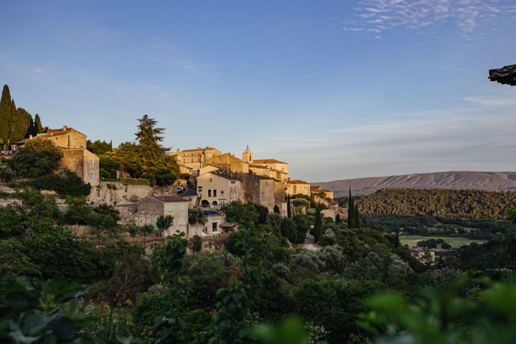 Hilltop village of Gordes at golden hour in Provence — Grange de Javon wedding