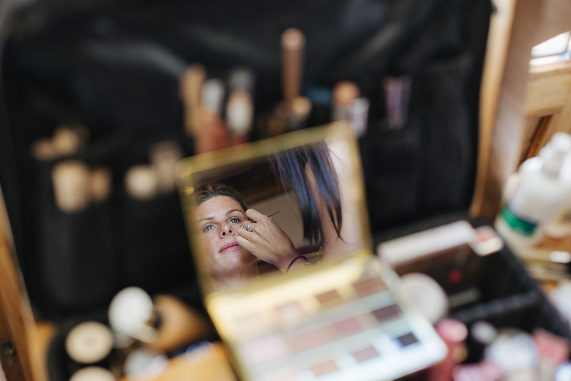 Bridal makeup reflected in a mirror while getting ready — Grange de Javon, Provence