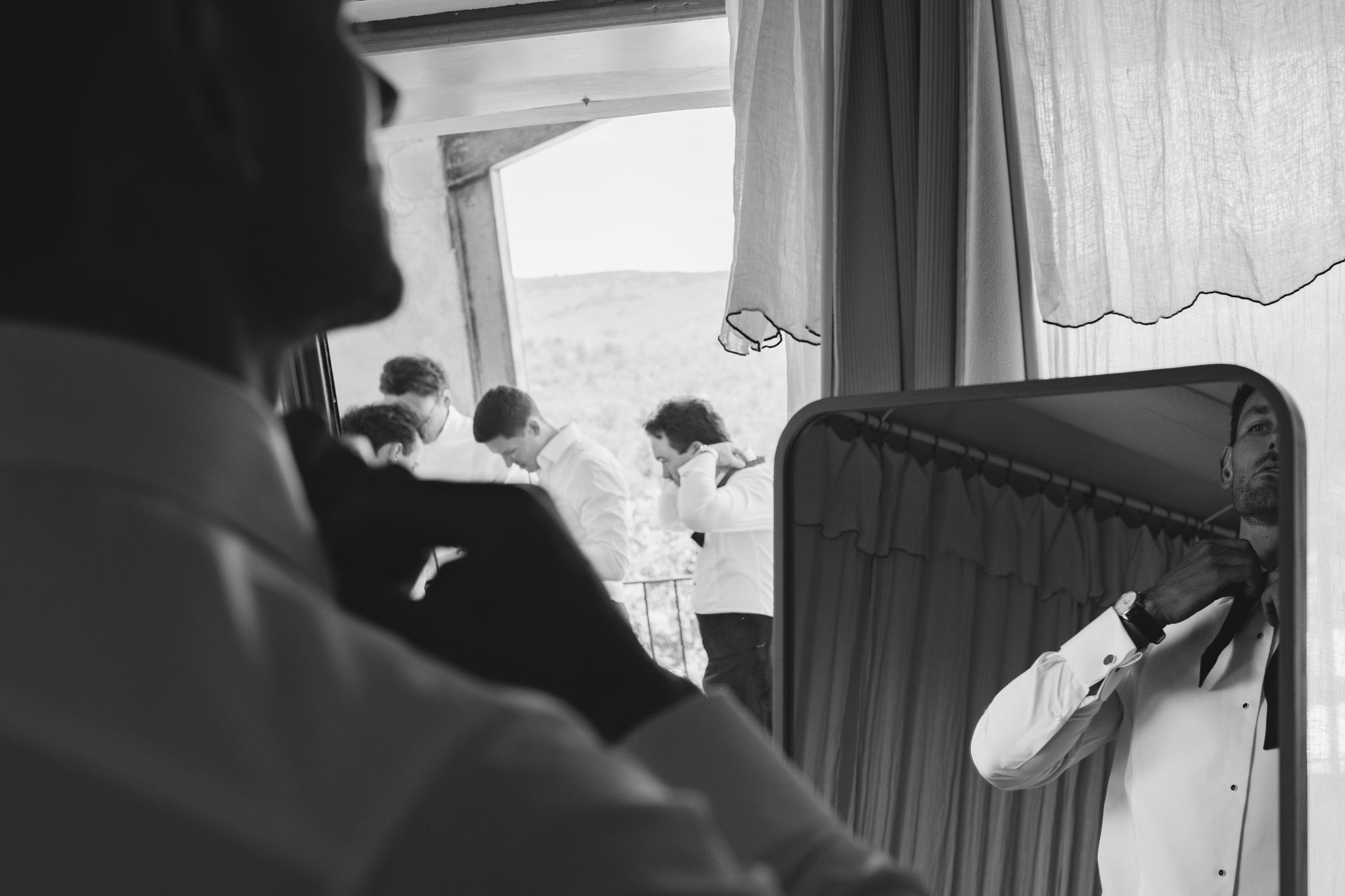 Groom in a quiet moment by the window — Grange de Javon, Provence