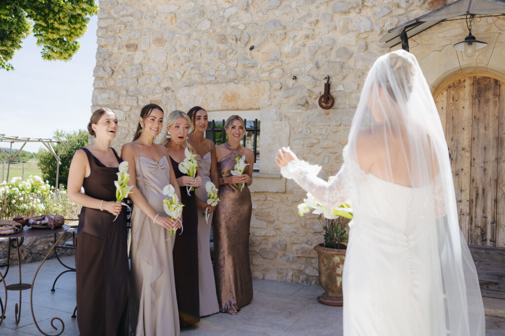 Bride laughing with her bridesmaids on the terrace — Grange de Javon wedding