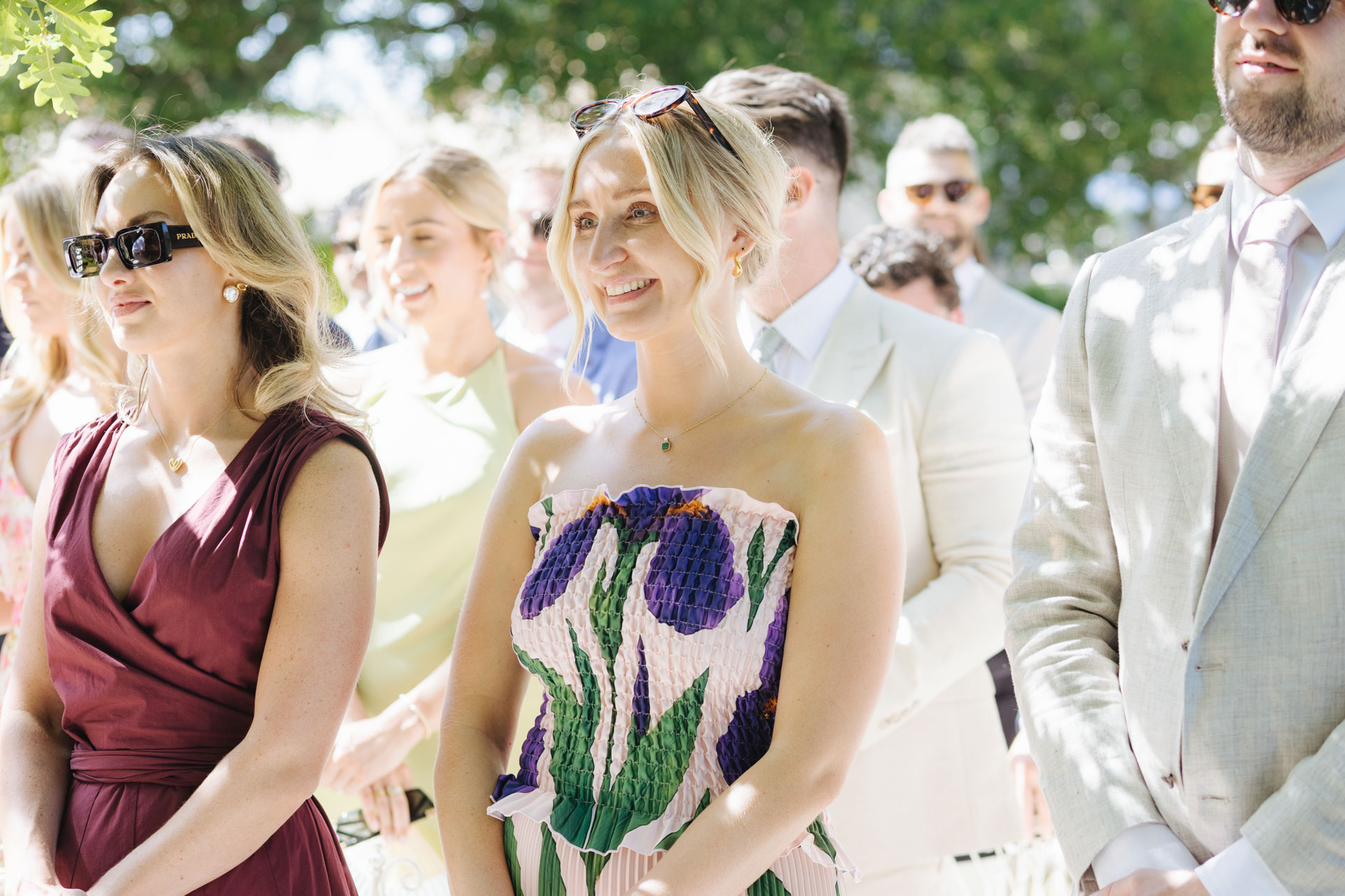 Guests smiling during the outdoor ceremony — Grange de Javon wedding