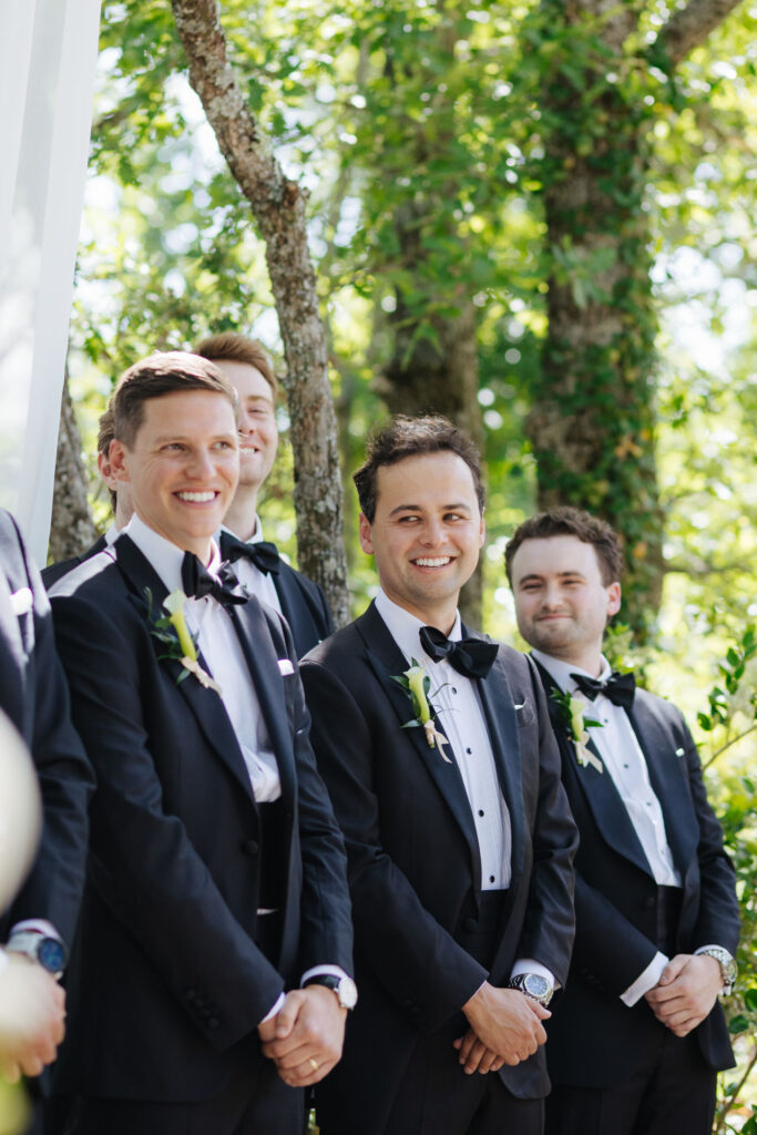 Groomsmen standing together at the ceremony — Grange de Javon, Provence