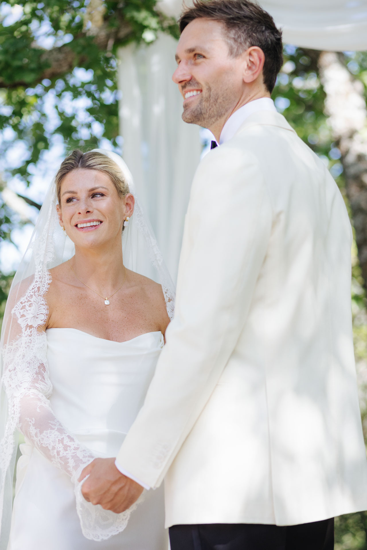 Bride and groom smiling during the ceremony — Grange de Javon, Provence