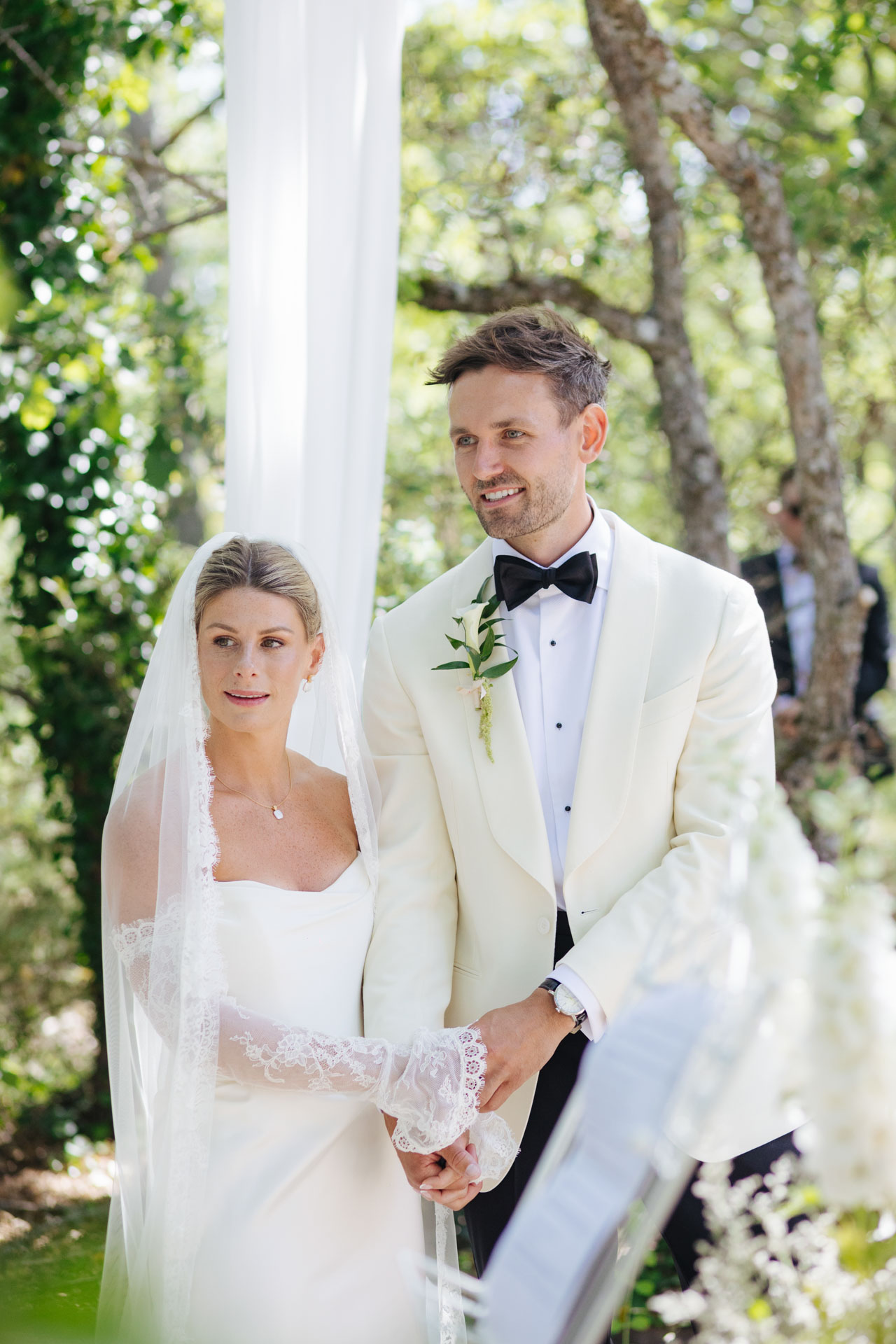 Newlyweds during the recessional under a flowing drape — Grange de Javon, Provence