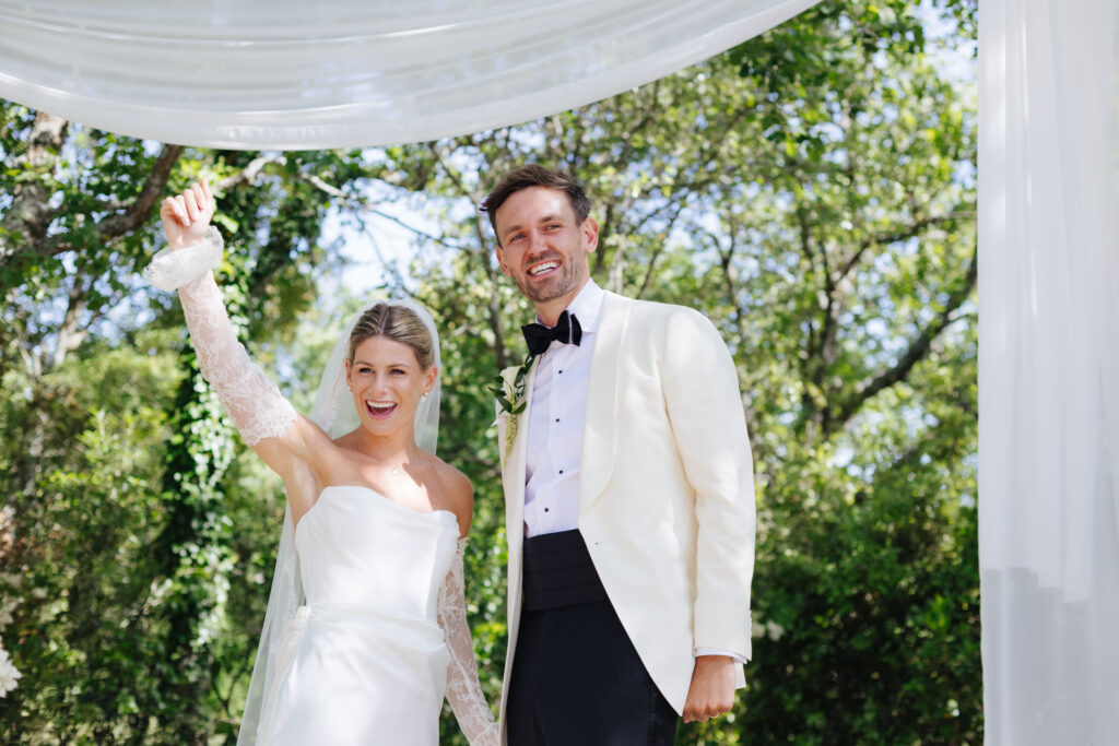 Bride and groom celebrating just after the ceremony — Grange de Javon wedding