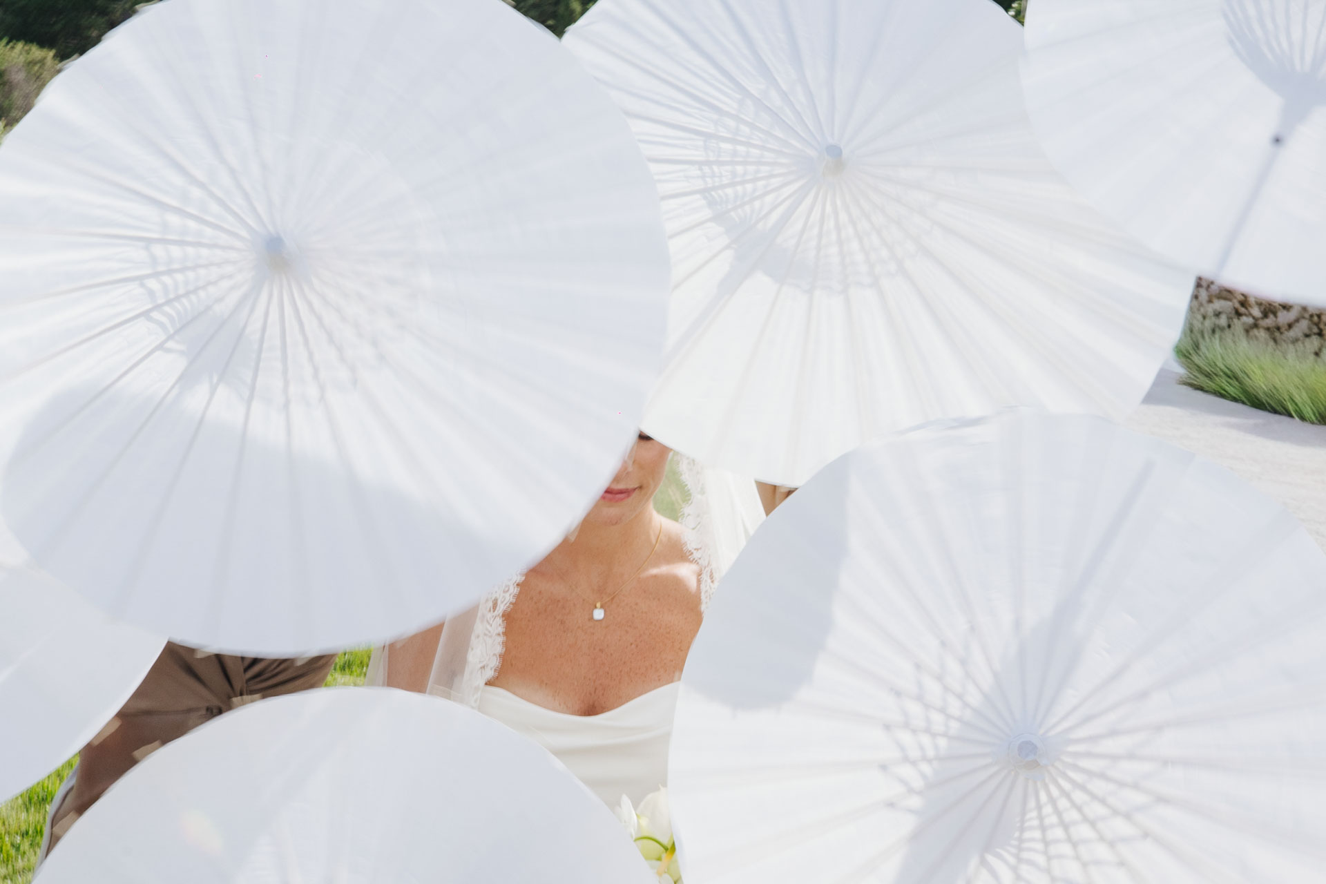 White parasols detail at cocktail hour — Grange de Javon, Provence