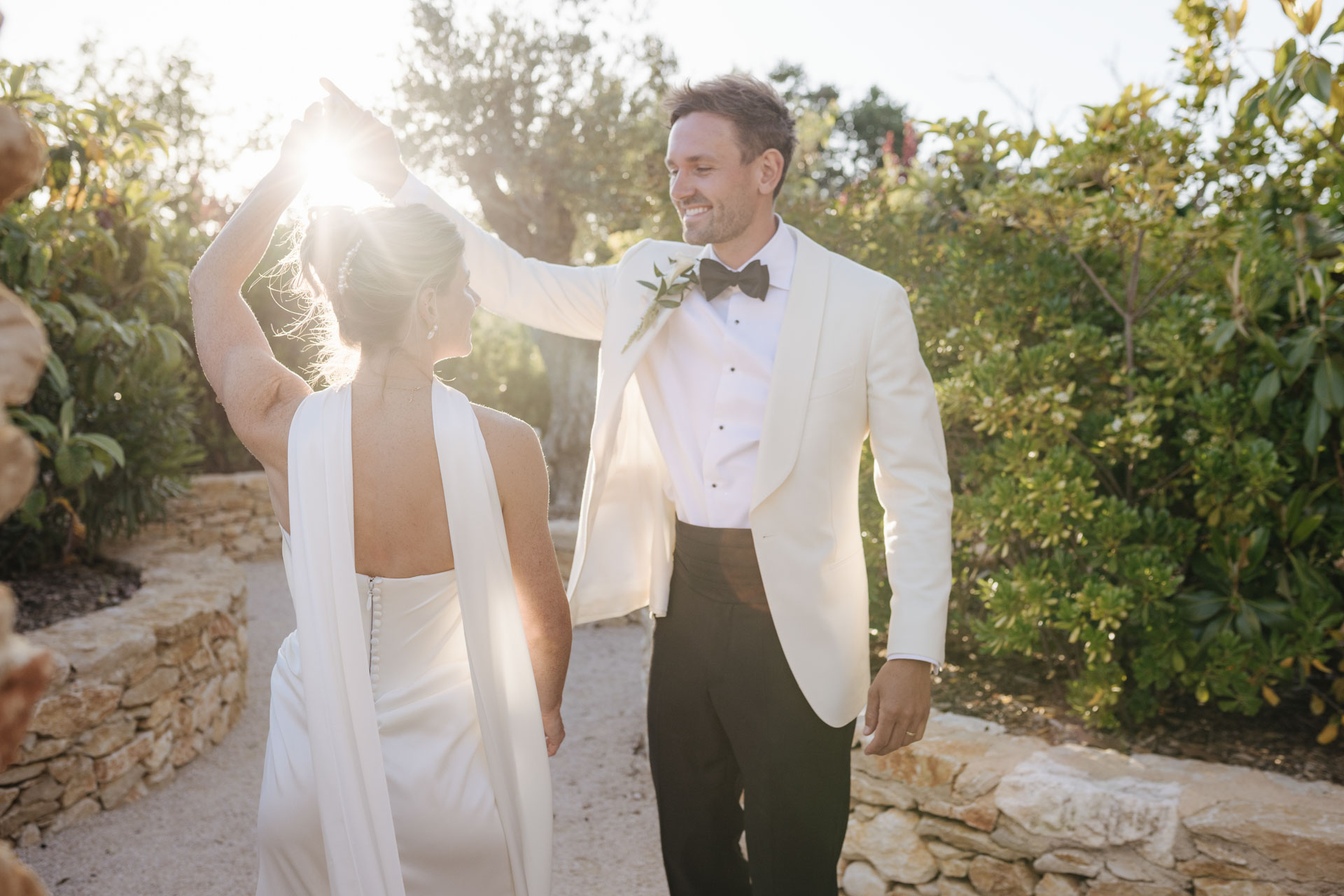 Groom twirling the bride in the evening light — Grange de Javon, Provence