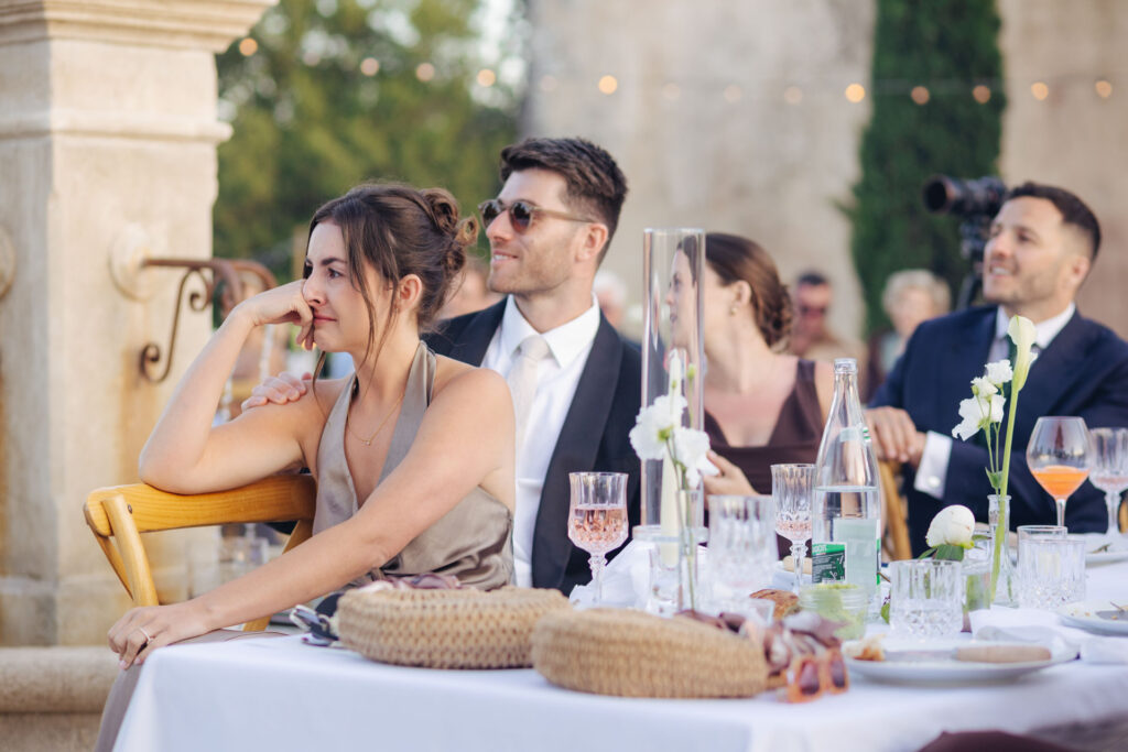 Guests laughing around the dinner table — Grange de Javon, Provence