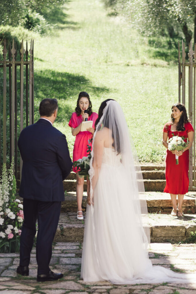 The bride's arrival at the ceremony, flanked by her bridesmaids