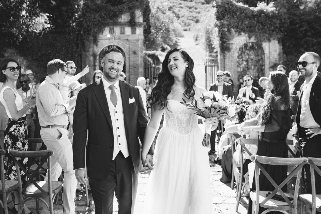 Newlyweds greeted by applause after the ceremony
