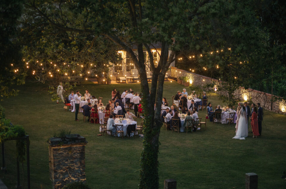 Wide view of the reception as evening falls over Villa Buonvisi